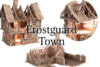 3D renders of Frostguard Town 3D printable STL terrain, showing a ruined two-story half-timbered medieval building and a crumbled stone wall section for 28mm wargaming.