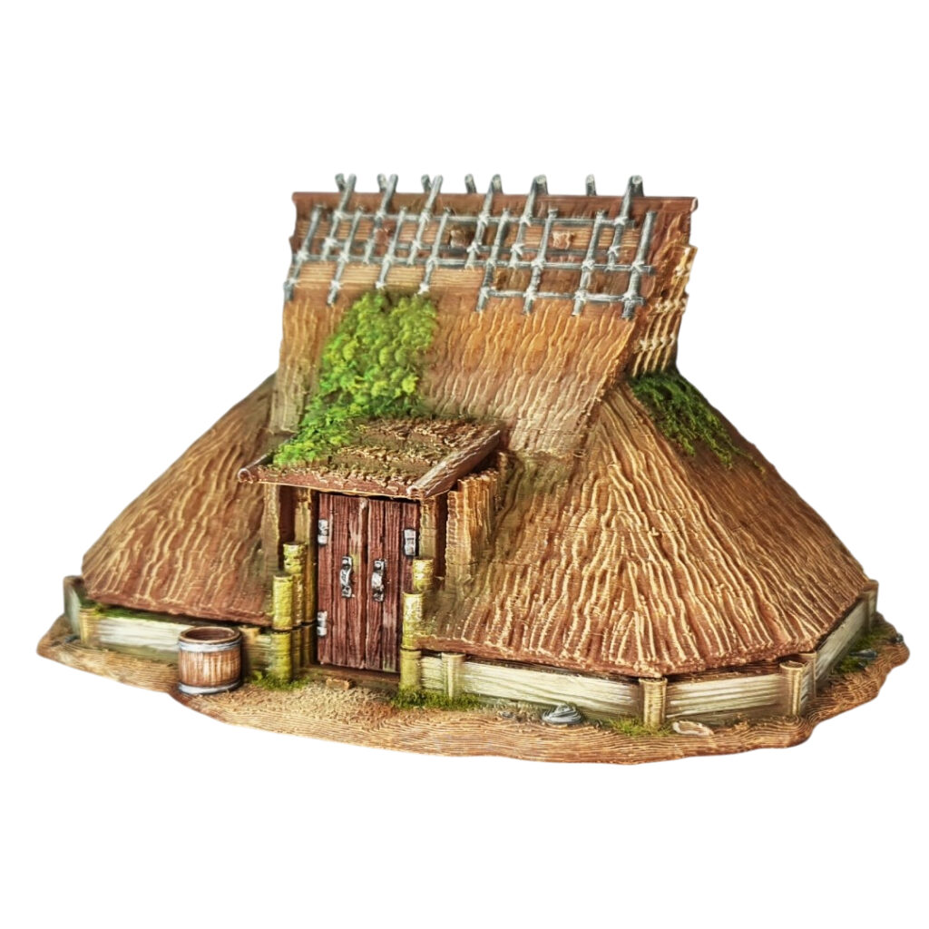 Defend your village with the Kabuto-Minka, a "samurai helmet" style farmhouse scaled for 28mm. This support-free FDM model features a dramatic, low-sweeping thatched roof and protective timber detailing—perfect for recreating the silk-farming mountain retreats and noble rural estates of feudal Japan.