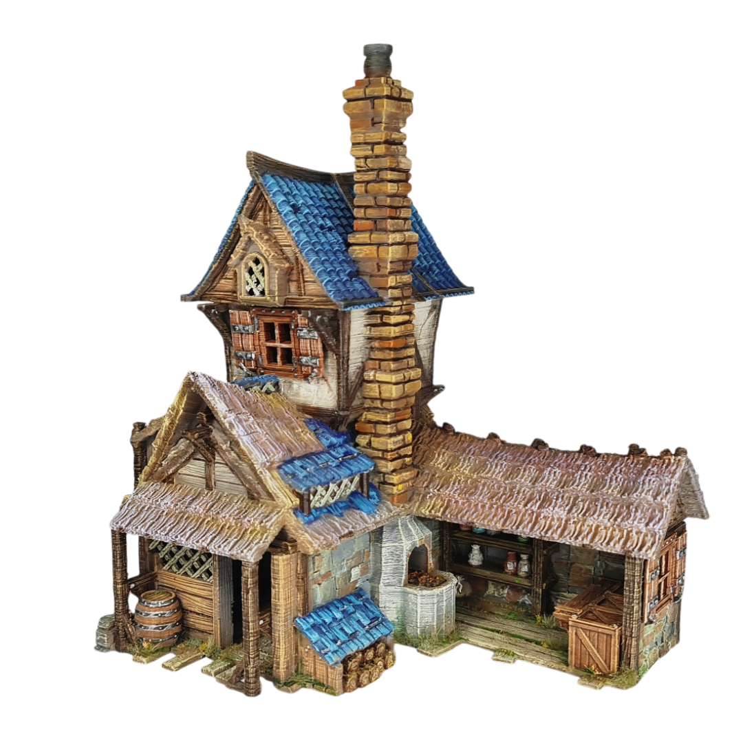3D printed and painted miniature of a medieval blacksmith building with a stone foundation, wooden wattle-and-daub walls, a side waterwheel, thatched awnings, and a striking blue tiled roof.